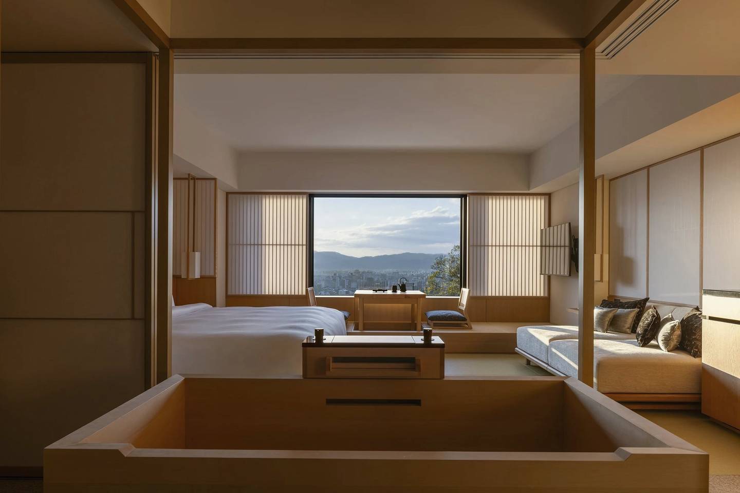 Timber guest room with a soaking tub and mountain view